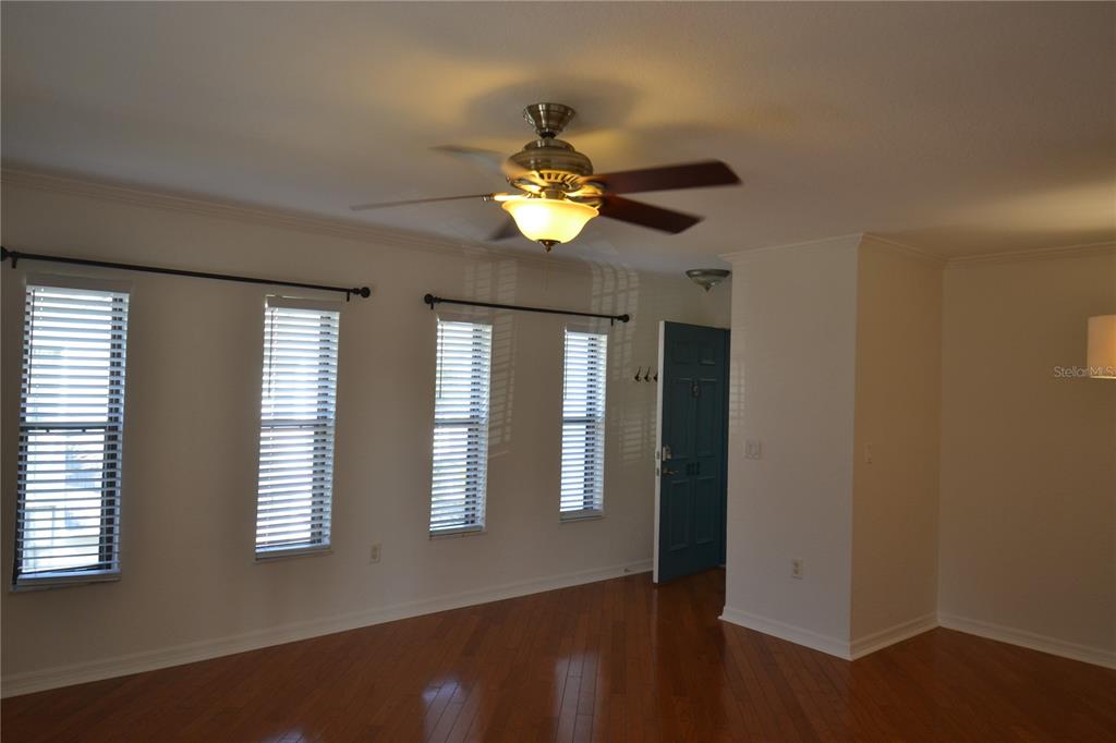 718 Lyndhurst Street, Unit 922 Dunedin, FL 34698 - Photo 18 of 39 a view of an empty room with a window