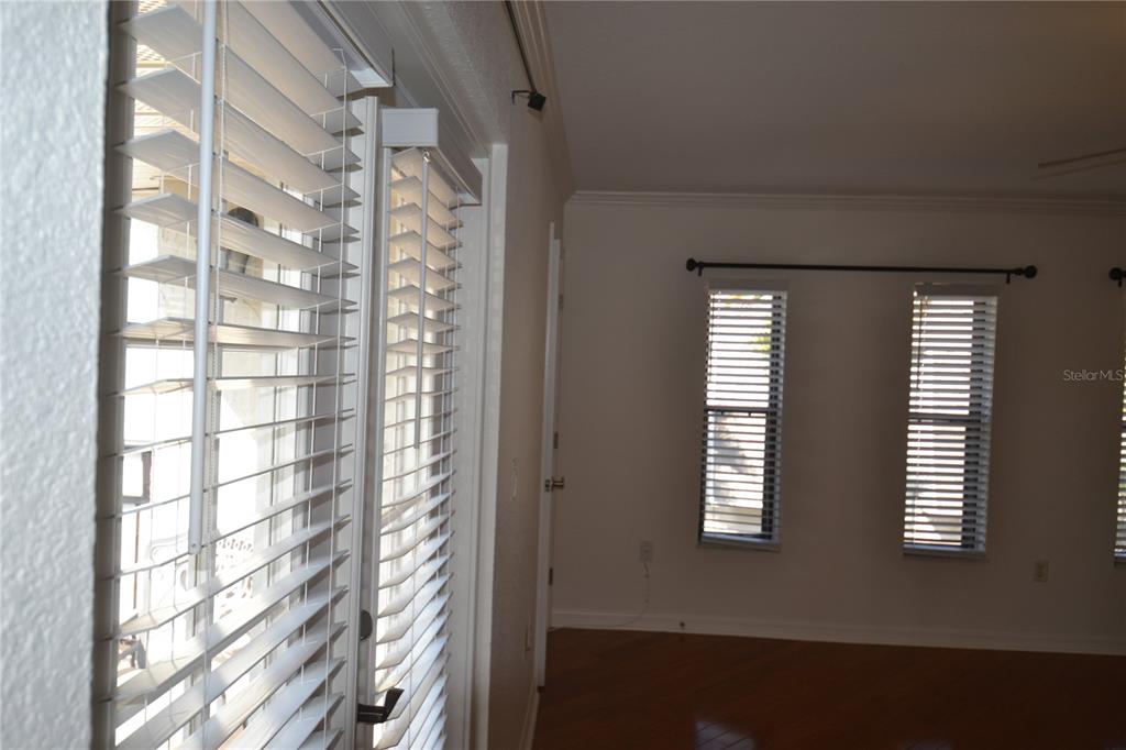 718 Lyndhurst Street, Unit 922 Dunedin, FL 34698 - Photo 20 of 39 a view of wooden floor and windows in a room