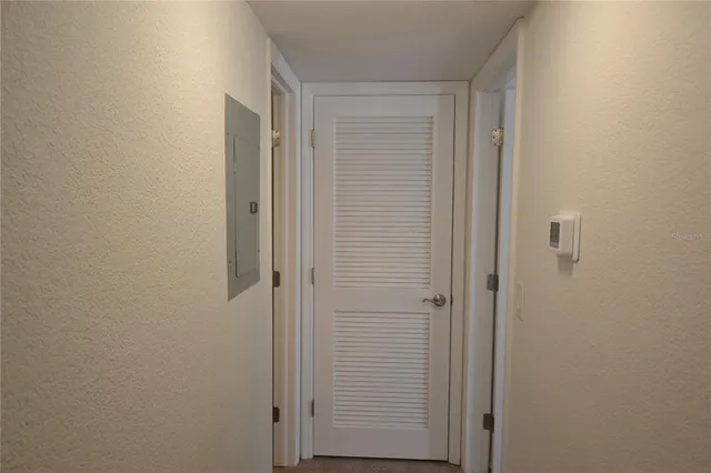 a bathroom with a granite countertop sink and a toilet
