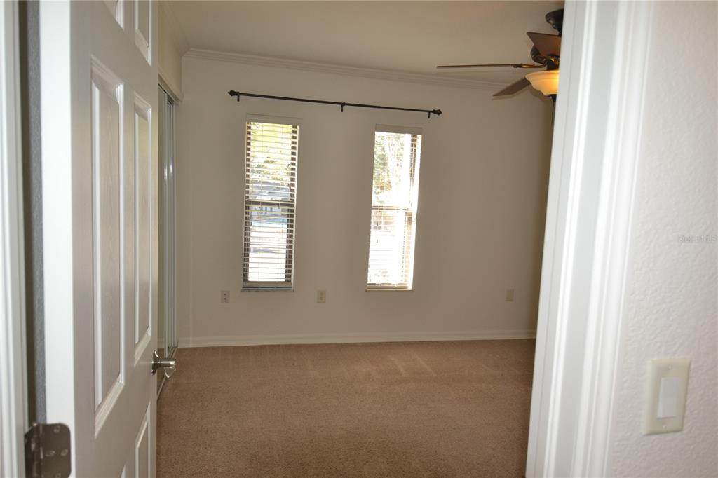 718 Lyndhurst Street, Unit 922 Dunedin, FL 34698 - Photo 24 of 39 a view of an empty room with a window