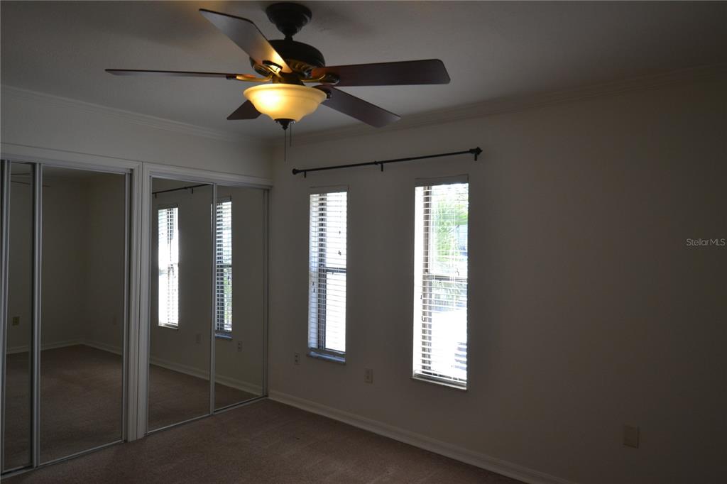 718 Lyndhurst Street, Unit 922 Dunedin, FL 34698 - Photo 26 of 39 a light window and a chandelier fan