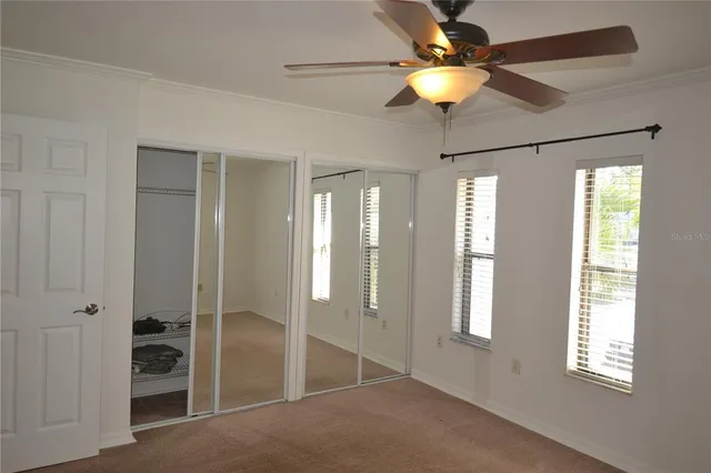a view of livingroom with hardwood floor and a ceiling fan