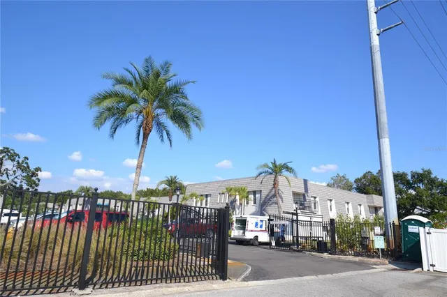 a view of a house with a yard covered with snow