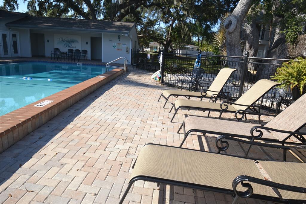 718 Lyndhurst Street, Unit 922 Dunedin, FL 34698 - Photo 34 of 39 a view of a swimming pool with a patio