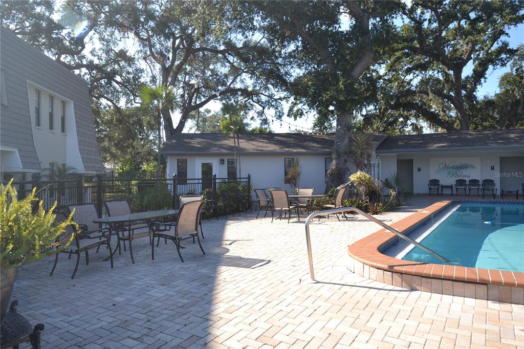 718 Lyndhurst Street, Unit 922 Dunedin, FL 34698 - Photo 35 of 39 a view of a house with backyard and sitting area