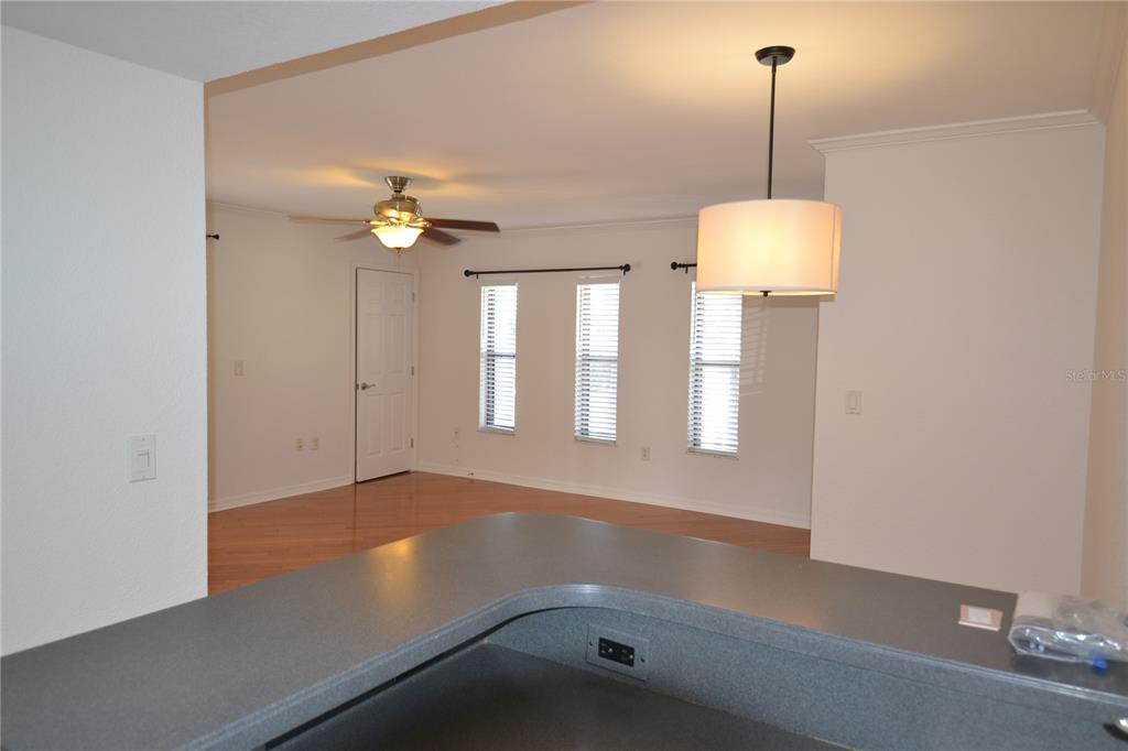 718 Lyndhurst Street, Unit 922 Dunedin, FL 34698 - Photo 5 of 39 a view of an empty room with a window