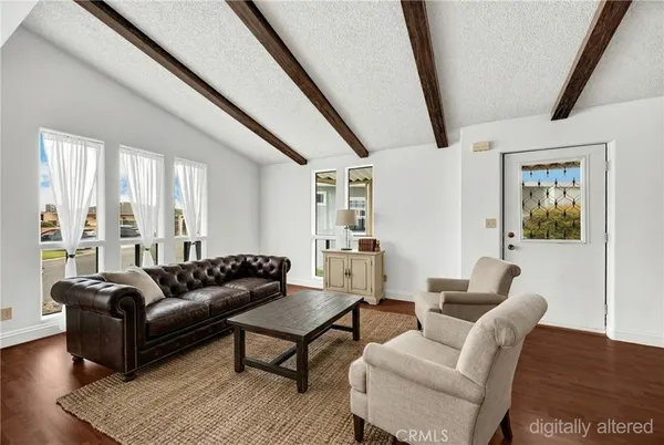 a living room with furniture and a rug