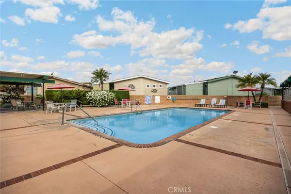 a view of a swimming pool with a patio