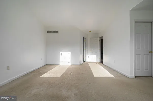 a view of a room that has a window