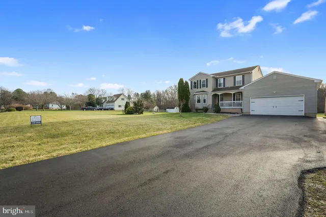 a house view with a big yard