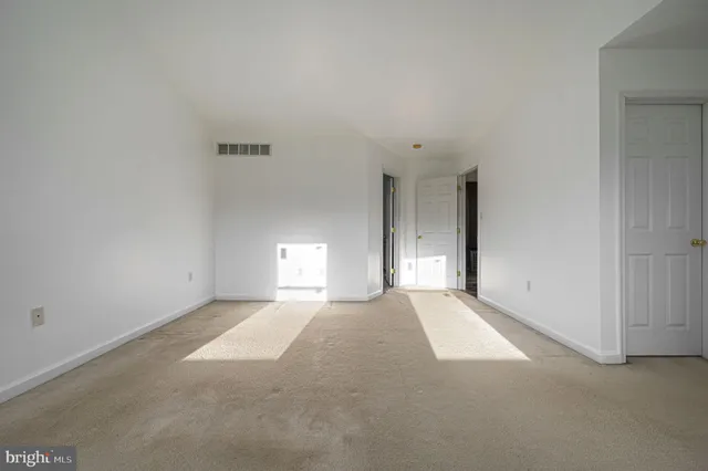 a view of a room that has a window