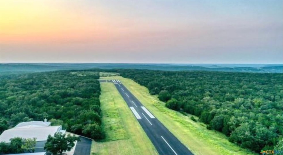 a view of a field with an ocean