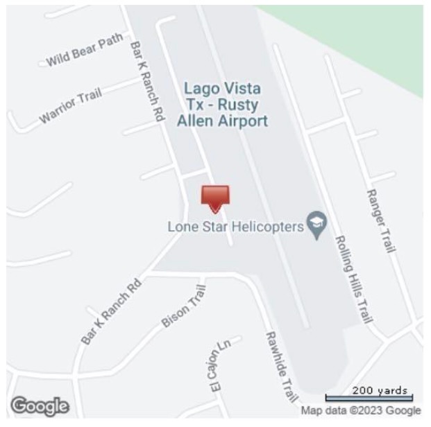 218 Flightline Road, Unit 7 Lago Vista, TX 78645 - Photo 9 of 9 a picture of a book and a white wall