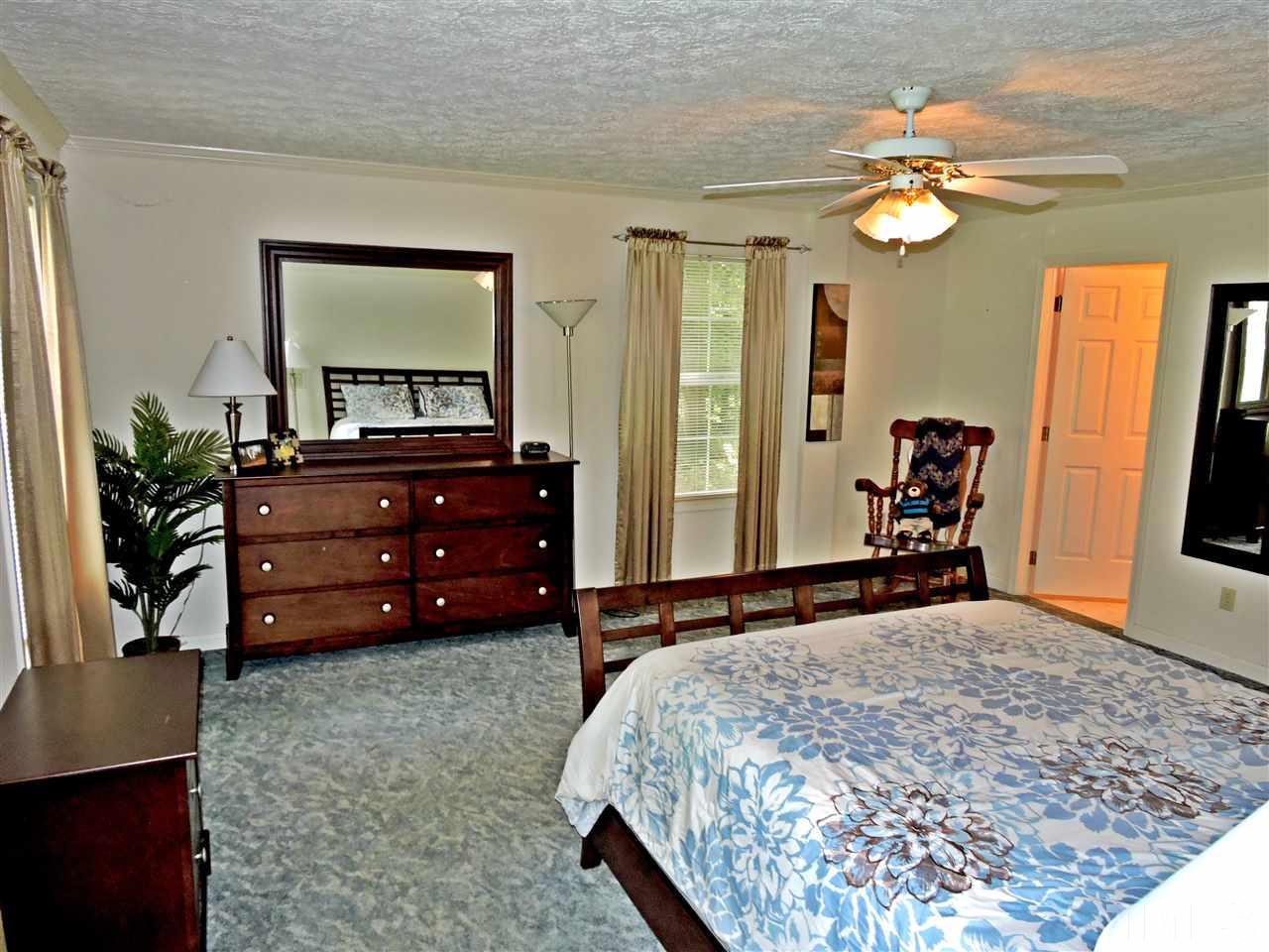 21 Landmark North Roxboro, NC 27574 - Photo 12 of 25 a bedroom with a bed and a dresser