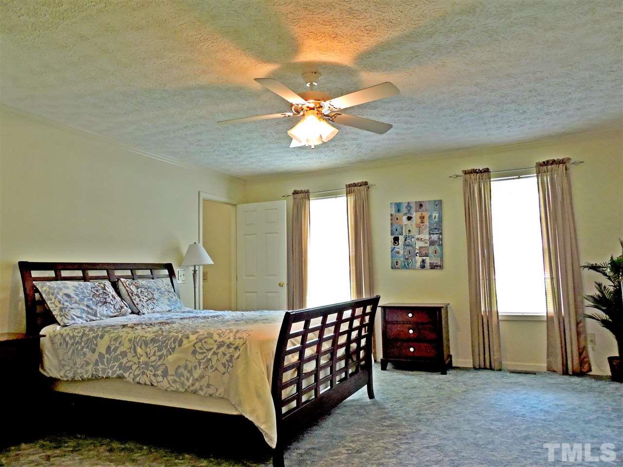 21 Landmark North Roxboro, NC 27574 - Photo 13 of 25 a bedroom with a bed and window