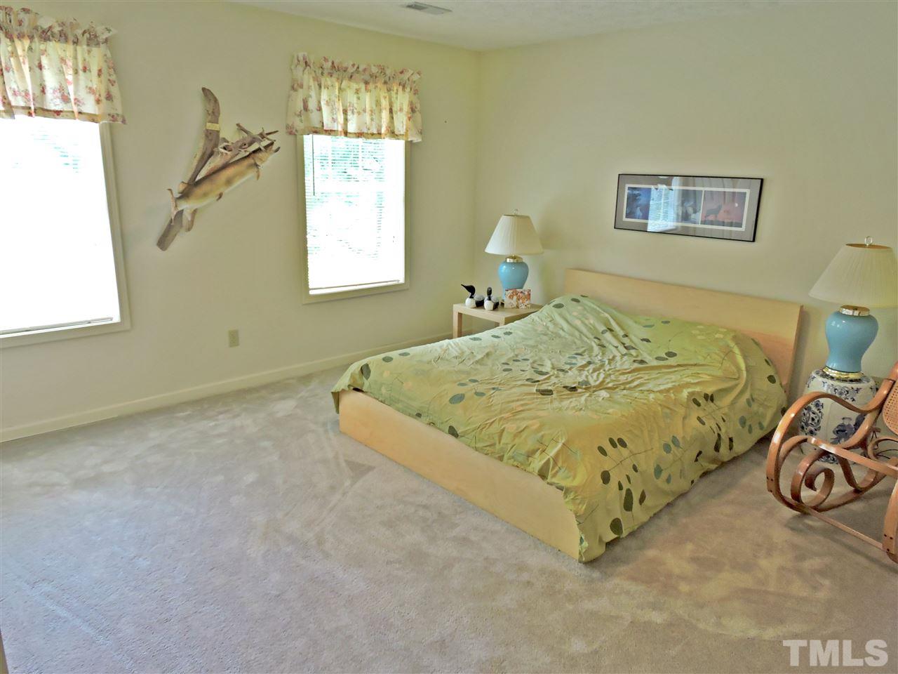 21 Landmark North Roxboro, NC 27574 - Photo 17 of 25 a bed sitting in a bedroom next to a window