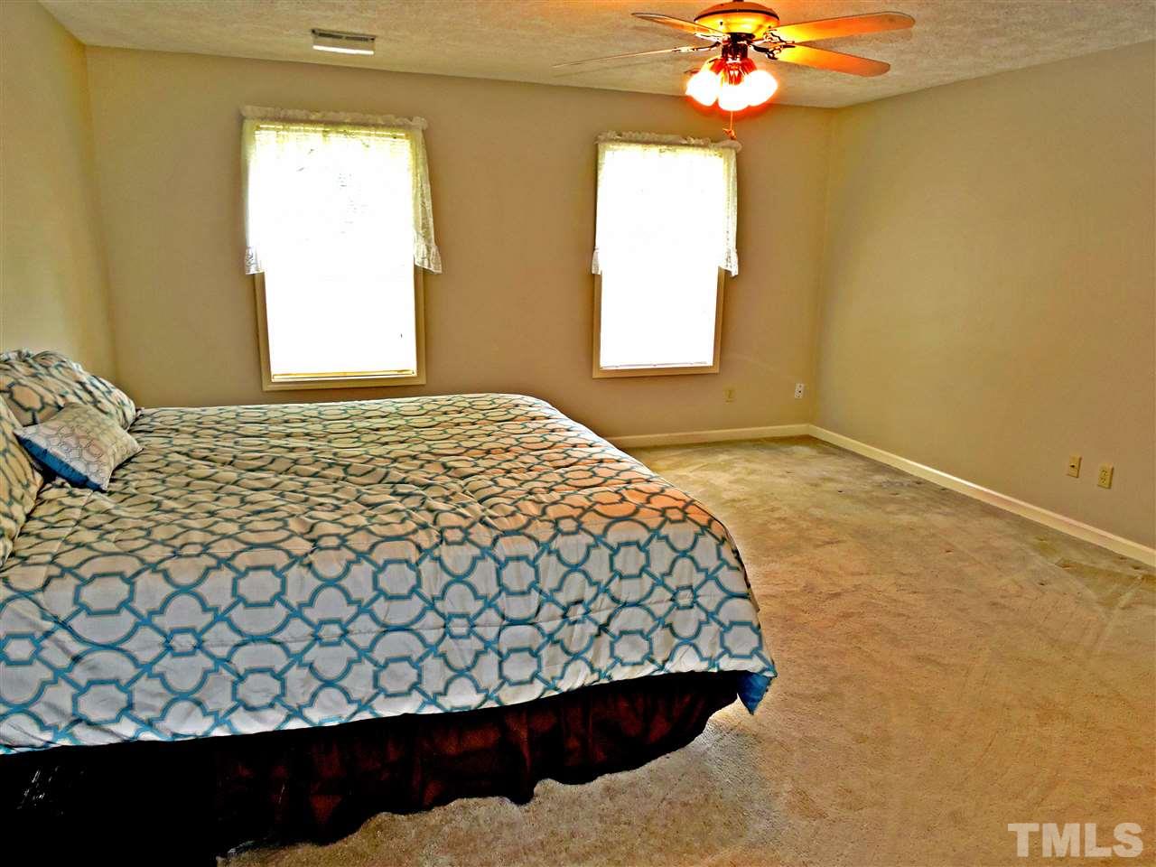 21 Landmark North Roxboro, NC 27574 - Photo 18 of 25 a bedroom with a bed and a window