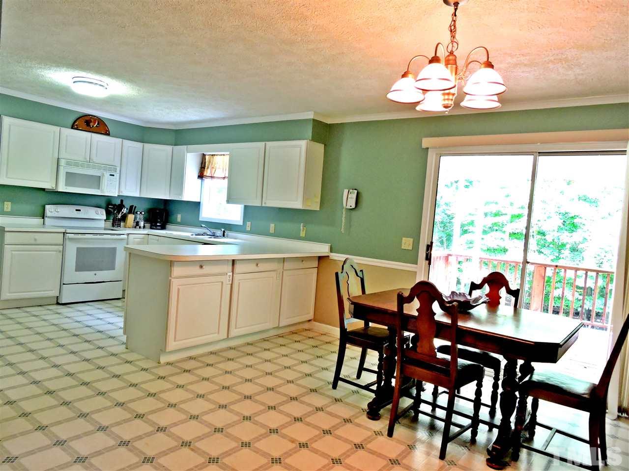 21 Landmark North Roxboro, NC 27574 - Photo 3 of 25 a view of a dining room with furniture window and outside view
