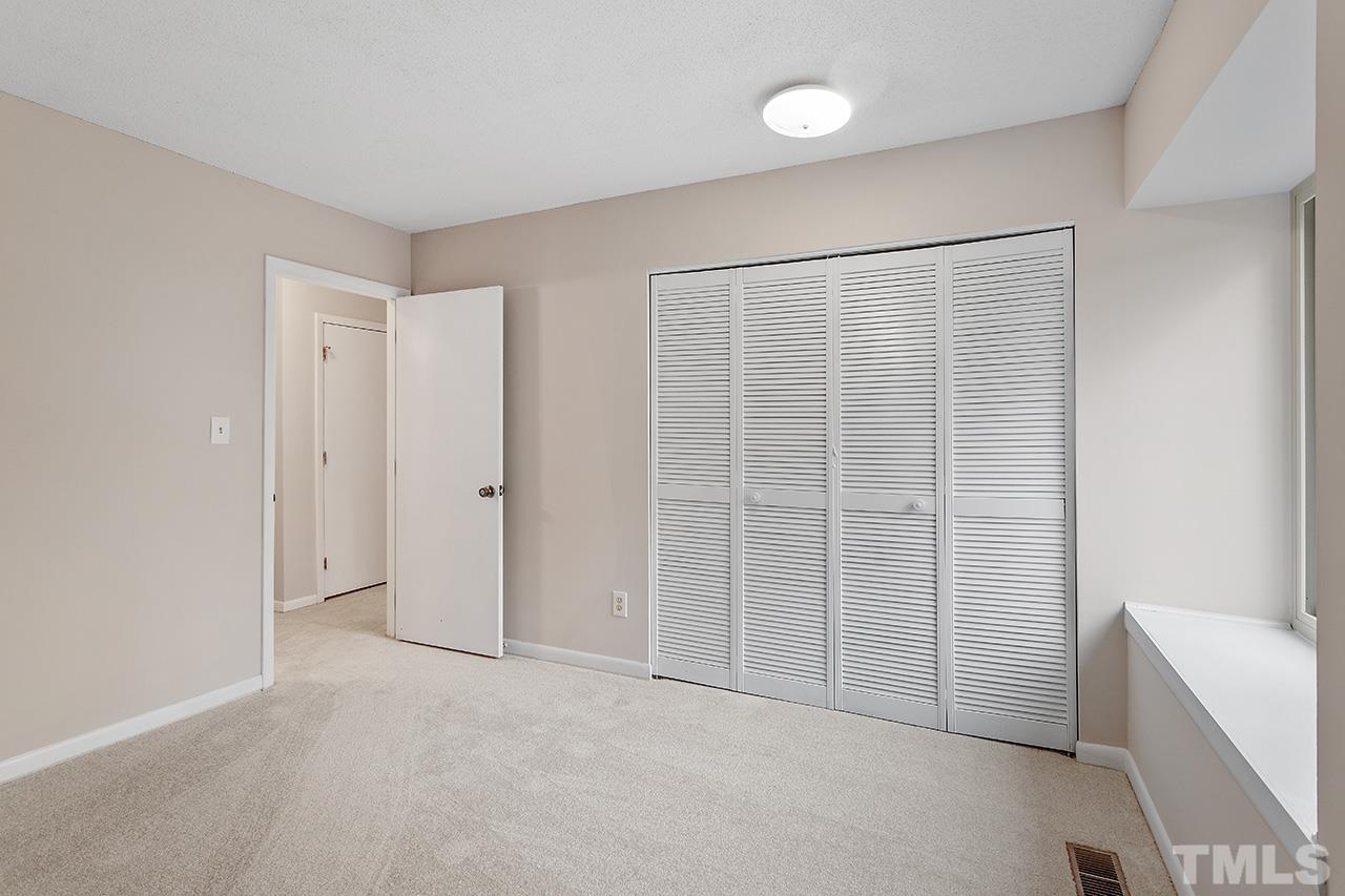 700 Green Ridge Drive Raleigh, NC 27609 - Photo 17 of 33 a view of an empty room with a window