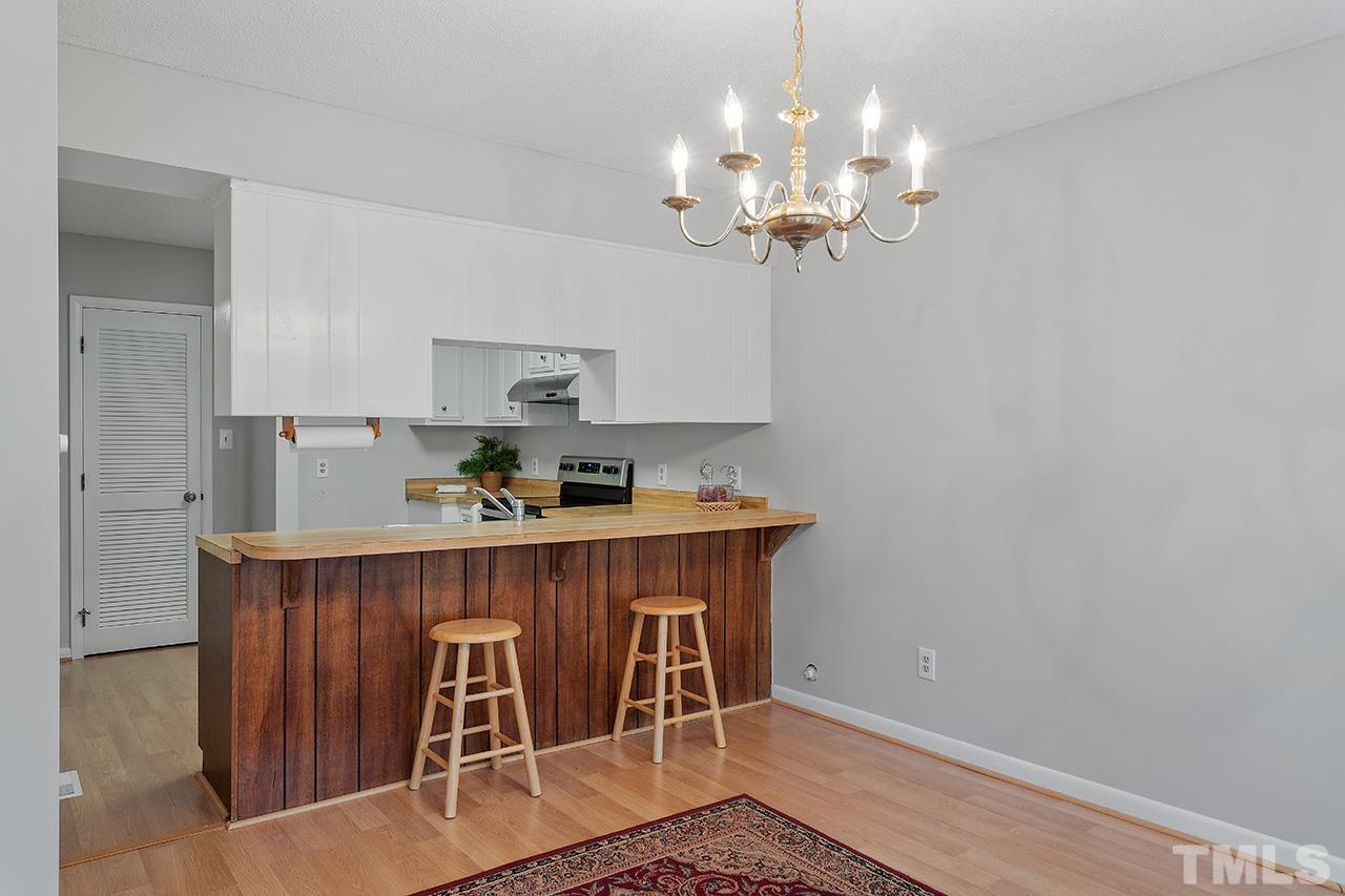 700 Green Ridge Drive Raleigh, NC 27609 - Photo 6 of 33 a dining room with wooden floor
