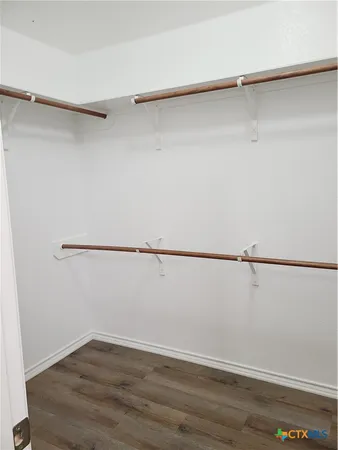 a view of an empty walk in closet
