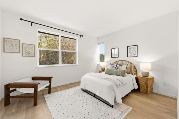 a bedroom with a bed and a table