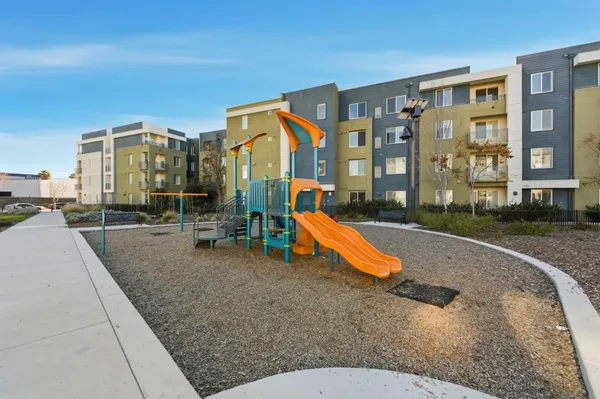 a swimming pool with outdoor seating and yard