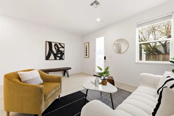 a living room with furniture and a window