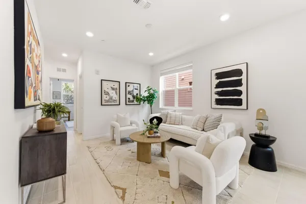 a living room with furniture and a window