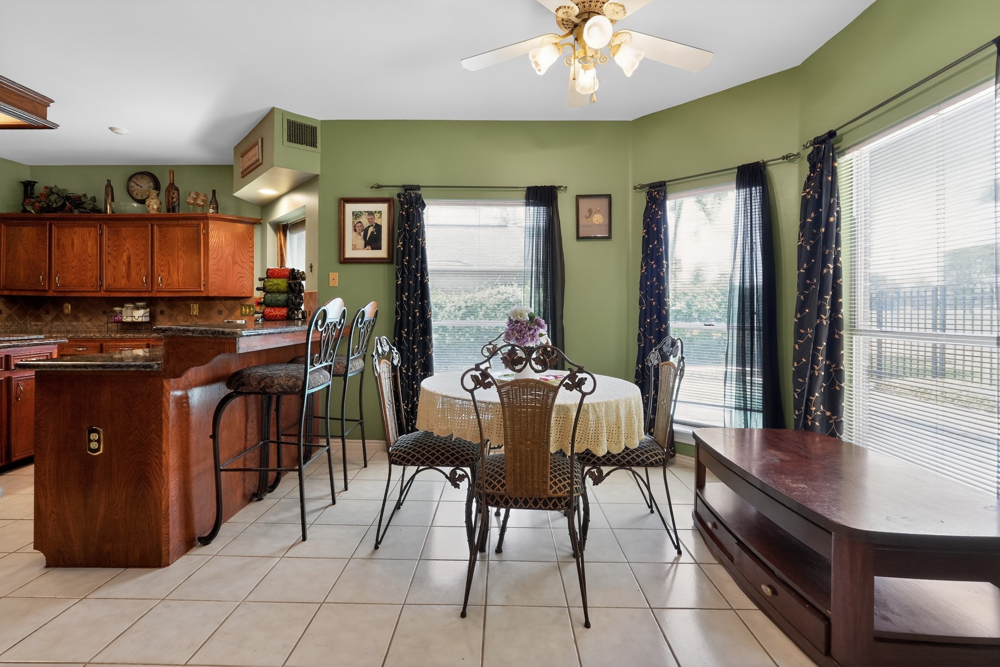 19027 Relay Road Humble, TX 77346 - Photo 13 of 29 Bright breakfast nook featuring large windows with a scenic view overlooking the backyard pool.