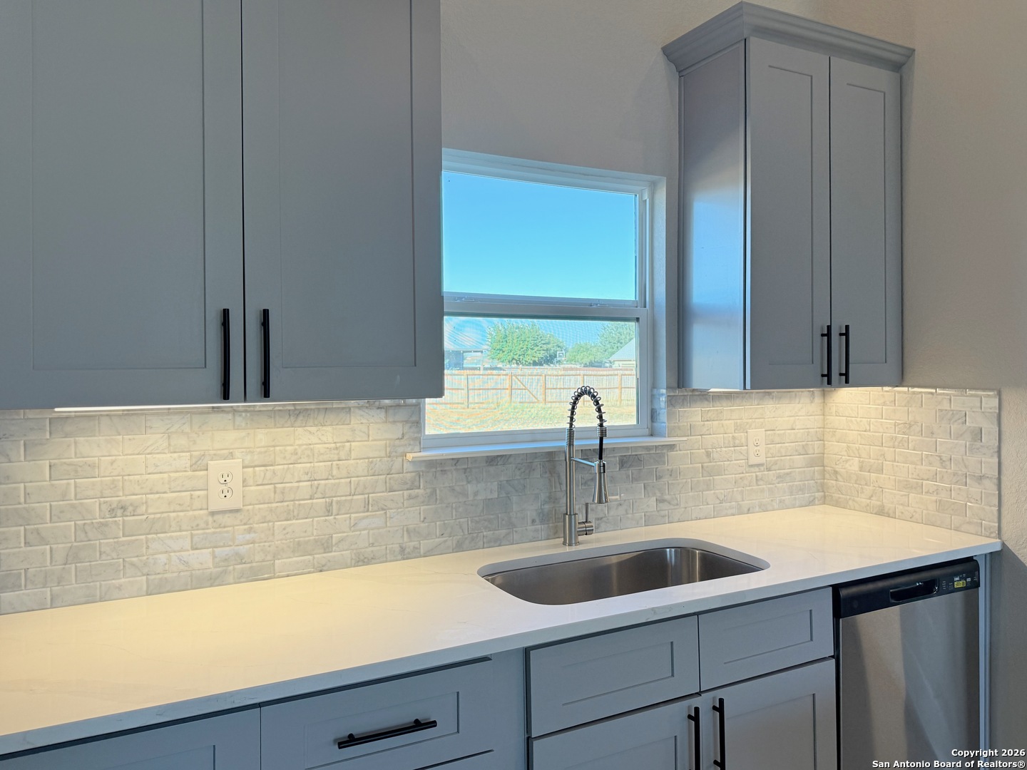 1313 Fm 3175 Lytle, TX 78052 - Photo 11 of 45 a kitchen with a sink and a window
