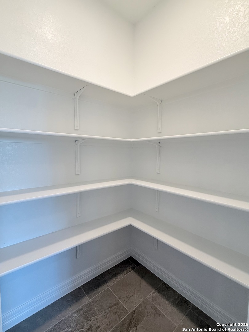 1313 Fm 3175 Lytle, TX 78052 - Photo 13 of 45 a storage room with cabinets