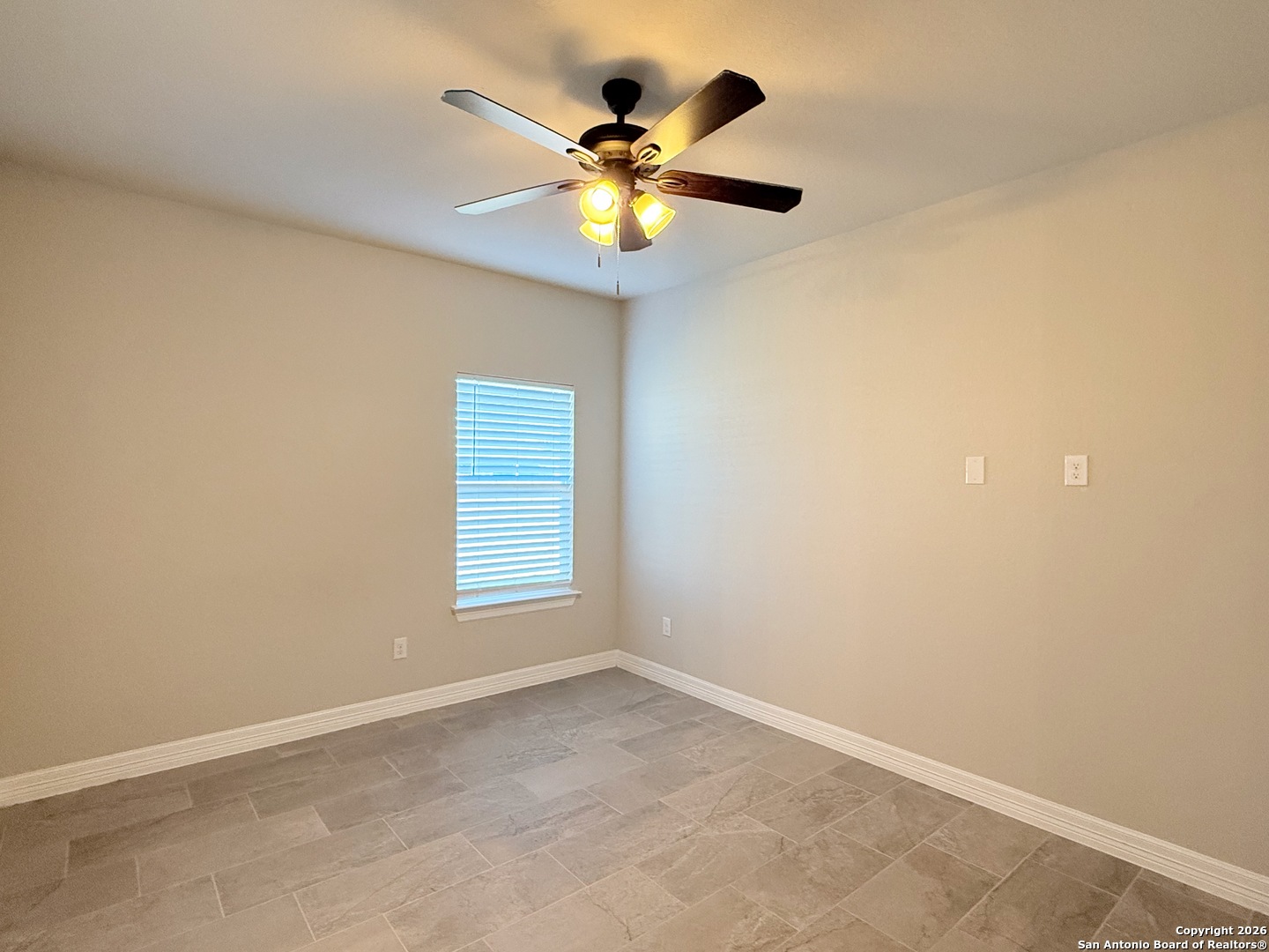 1313 Fm 3175 Lytle, TX 78052 - Photo 20 of 45 an empty room with window and ceiling fan