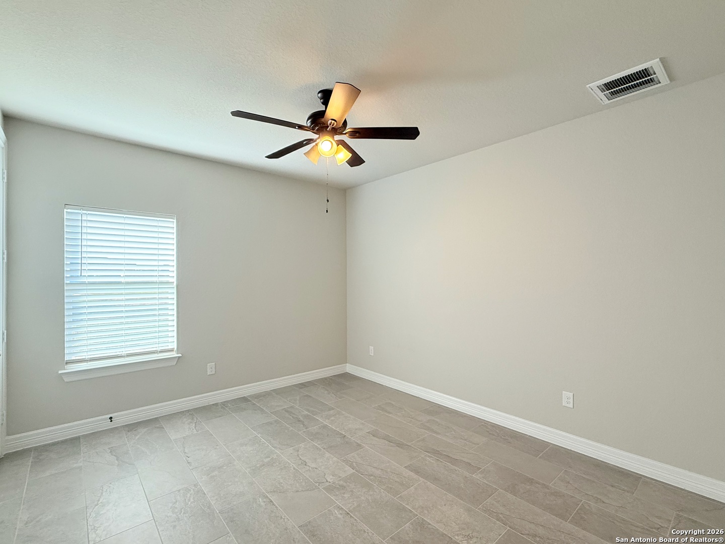 1313 Fm 3175 Lytle, TX 78052 - Photo 24 of 45 wooden floor in an empty room with a window