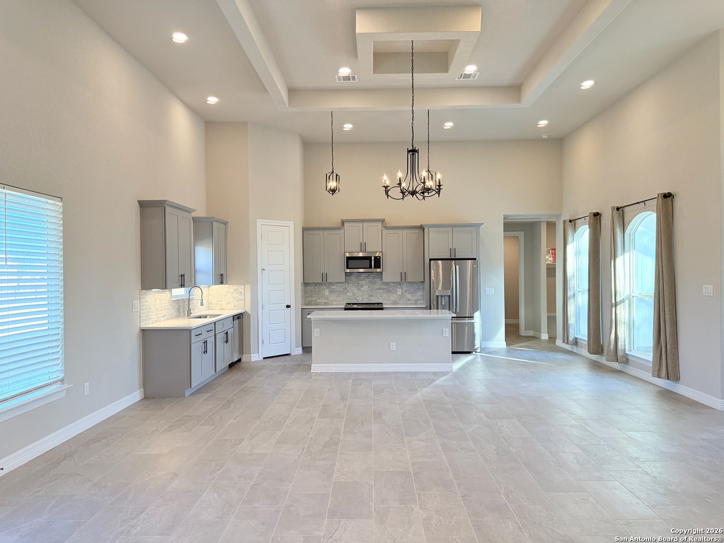 1313 Fm 3175 Lytle, TX 78052 - Photo 4 of 45 a large kitchen with kitchen island a sink stainless steel appliances and cabinets