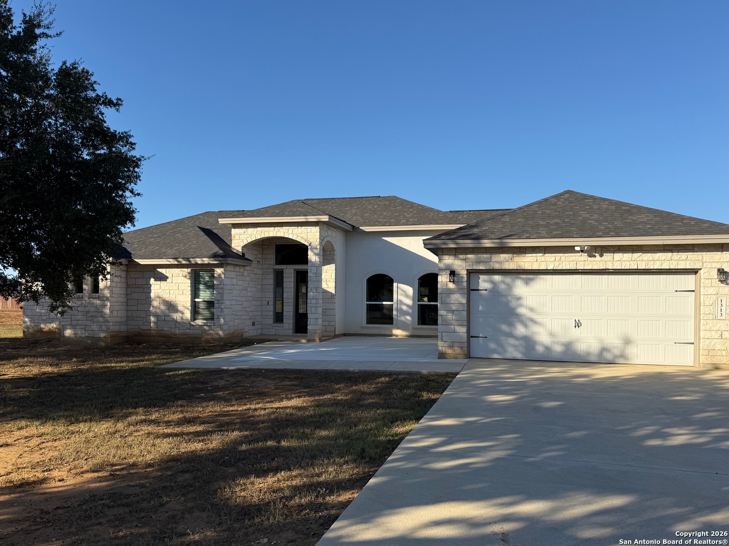 1313 Fm 3175 Lytle, TX 78052 - Photo 44 of 45 a front view of a house with a yard