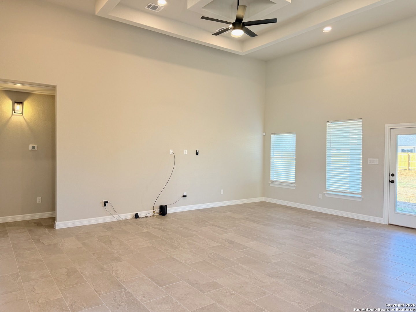 1313 Fm 3175 Lytle, TX 78052 - Photo 6 of 45 an empty room with windows and fan