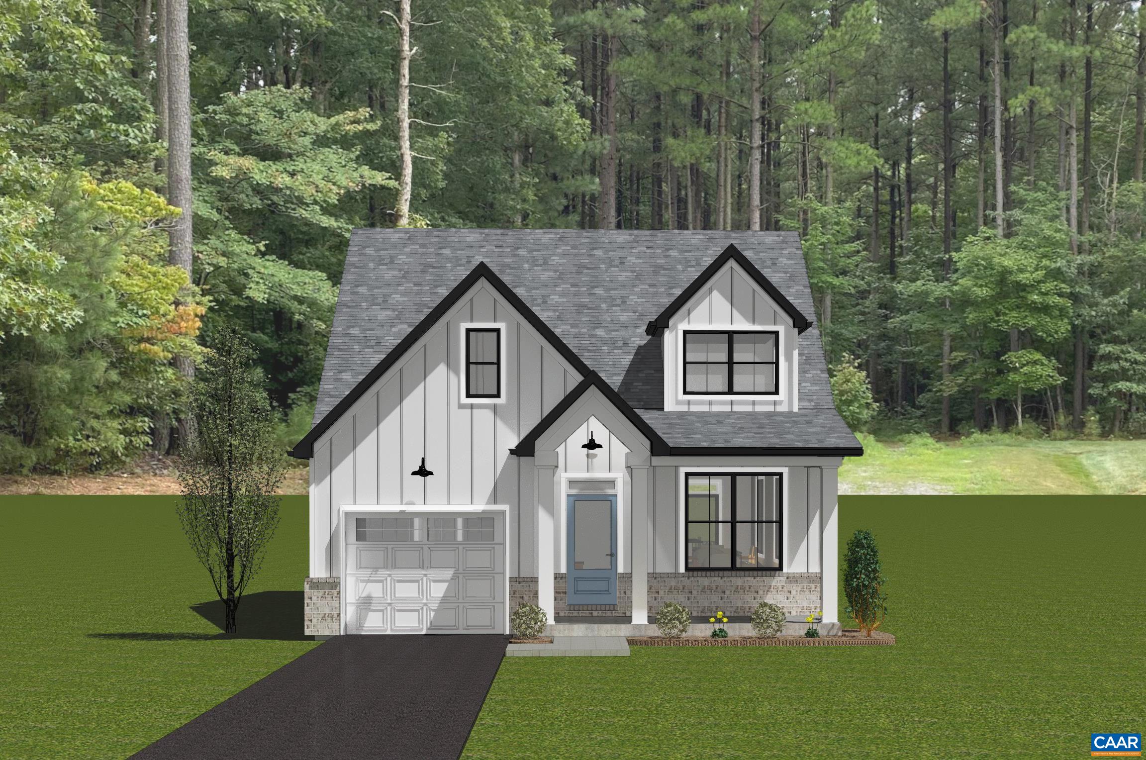 a front view of a house with a garden and yard