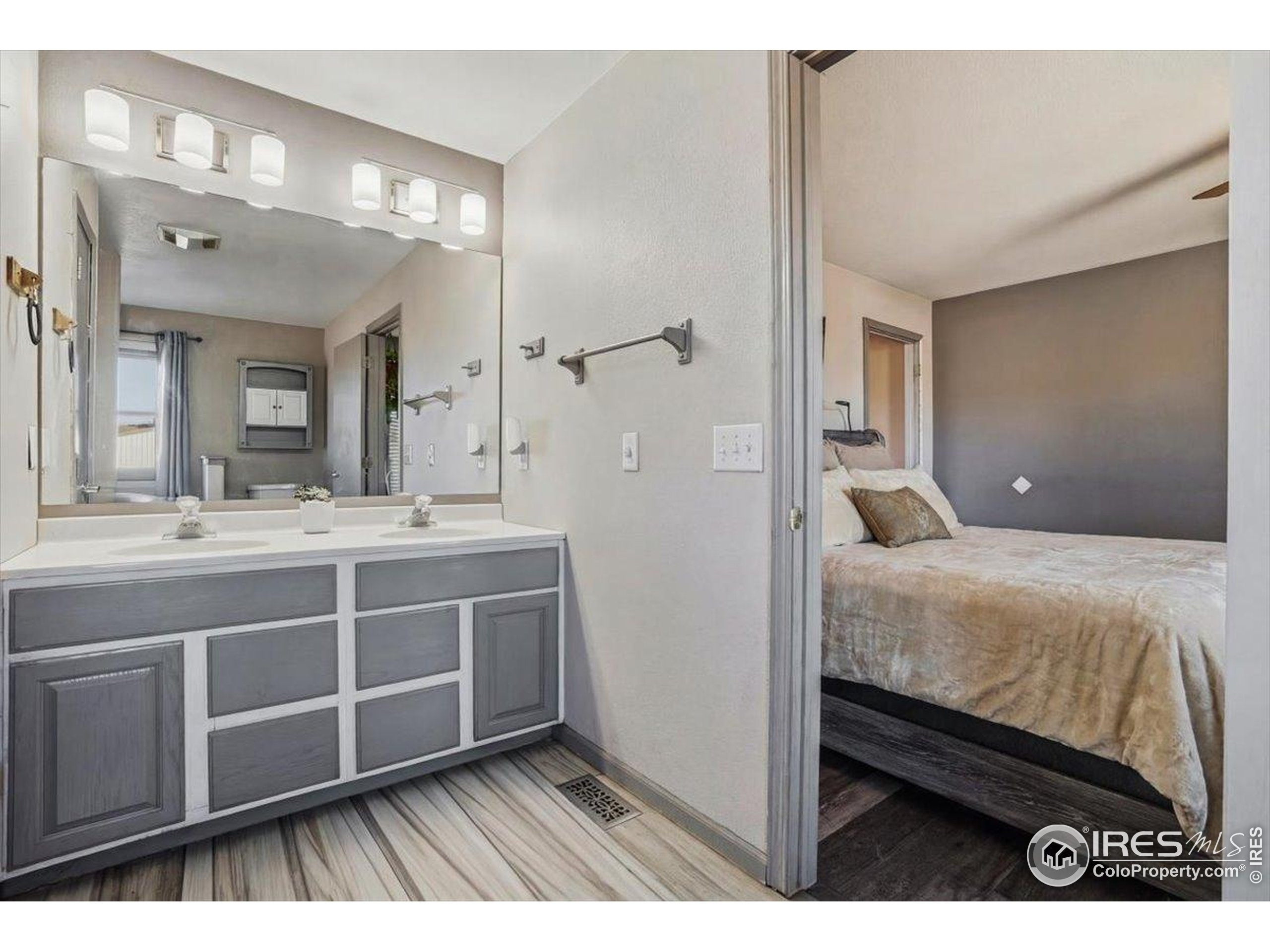 601 Red Mountain Road Livermore, CO 80536 - Photo 16 of 49 a en suite bathroom with a sink double vanity and a mirror