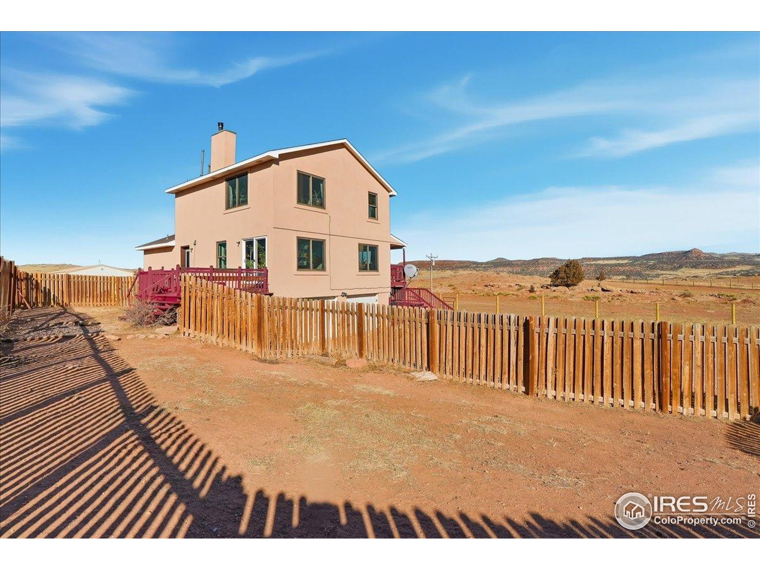 601 Red Mountain Road Livermore, CO 80536 - Photo 32 of 49 a view of a house with a balcony