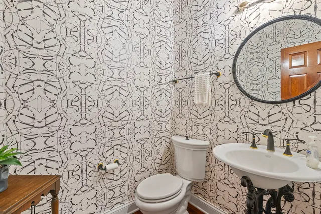 a bathroom with a toilet and a sink