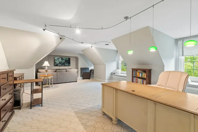 a kitchen with stainless steel appliances kitchen island granite countertop a refrigerator and a sink