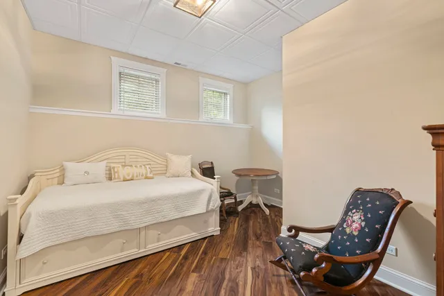 a bedroom with a bed and chair