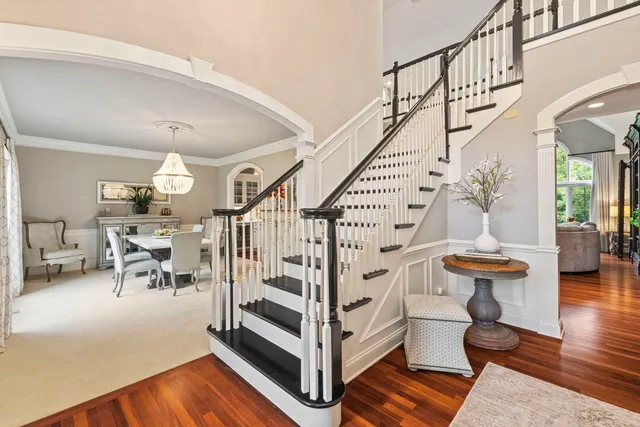 a view of entryway livingroom and hall with wooden floor