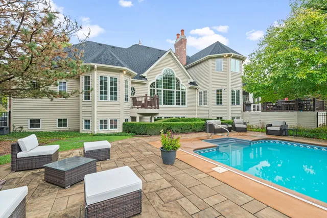 a front view of house with yard and outdoor seating