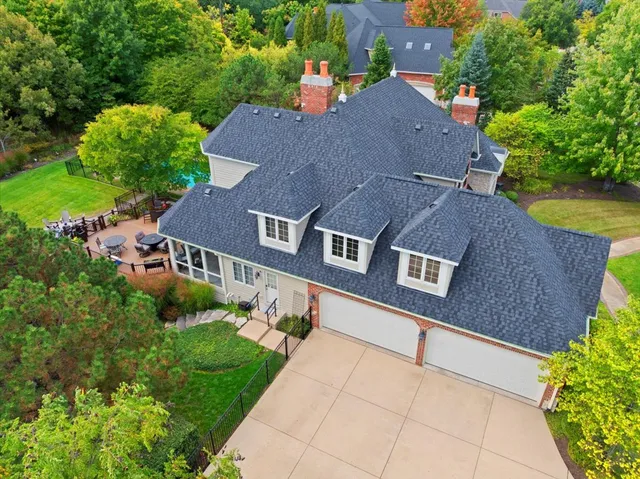 an aerial view of house with yard