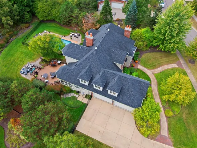 an aerial view of a house with a yard