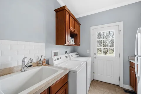 a bathroom with a sink and a window