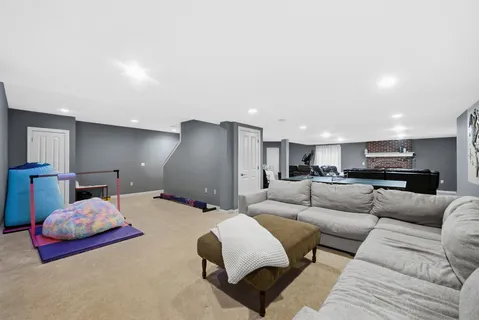 a living room with furniture and kitchen view
