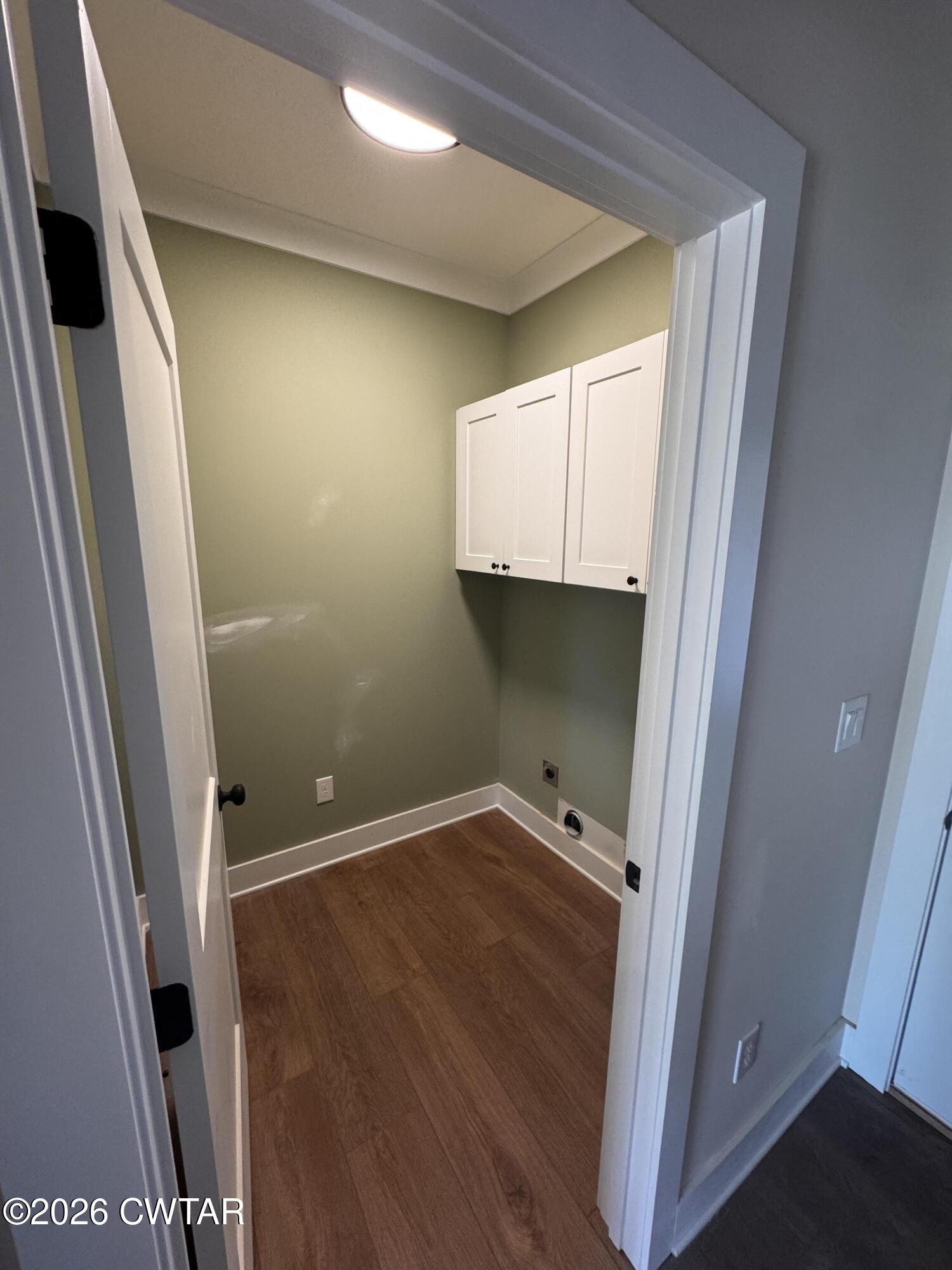 24 Tea Berry Cove Jackson, TN 38305 - Photo 15 of 16 a view of an empty room with wooden floor and a window